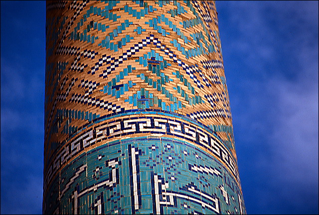 Turquoise ceramic tilework on minaret in Iran