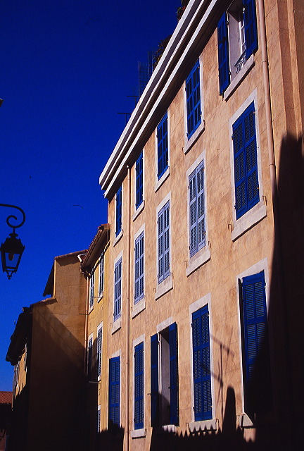 Blue shutters and sunlight in southern France