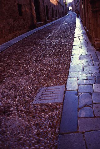 Narrow cobblestone alleyway in Old Town Rhodes