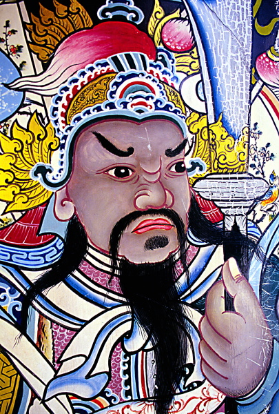 Intricate Buddhist mural painting detail in Thailand